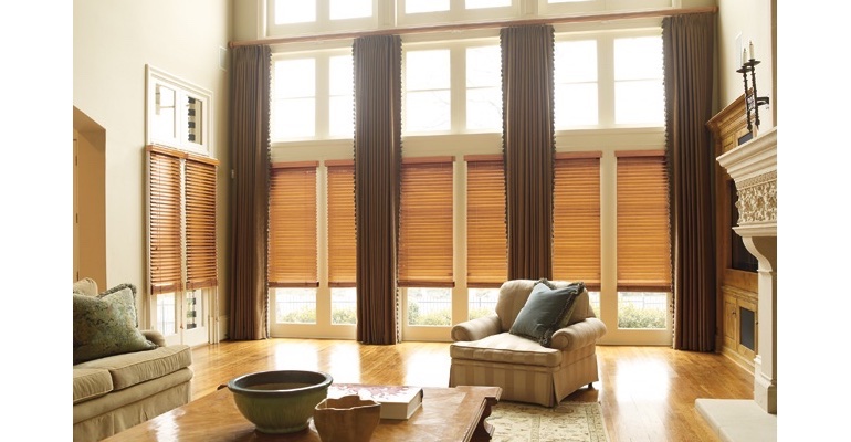 Denver great room with wood blinds and full-length draperies.